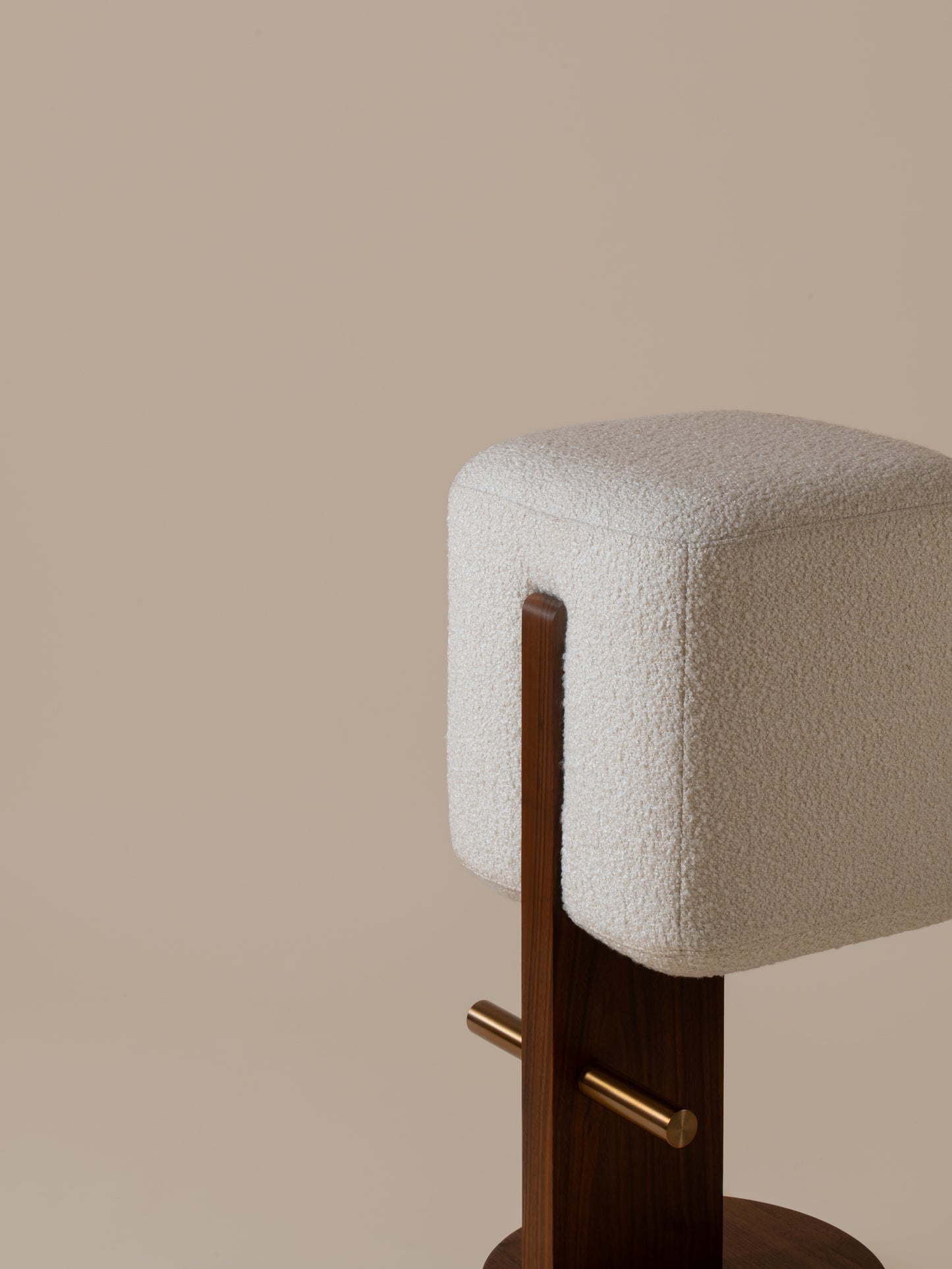 Close-up angled front view of plush cream bouclé seat and walnut base on Moment 2.5 Ice Cream Bar Stool